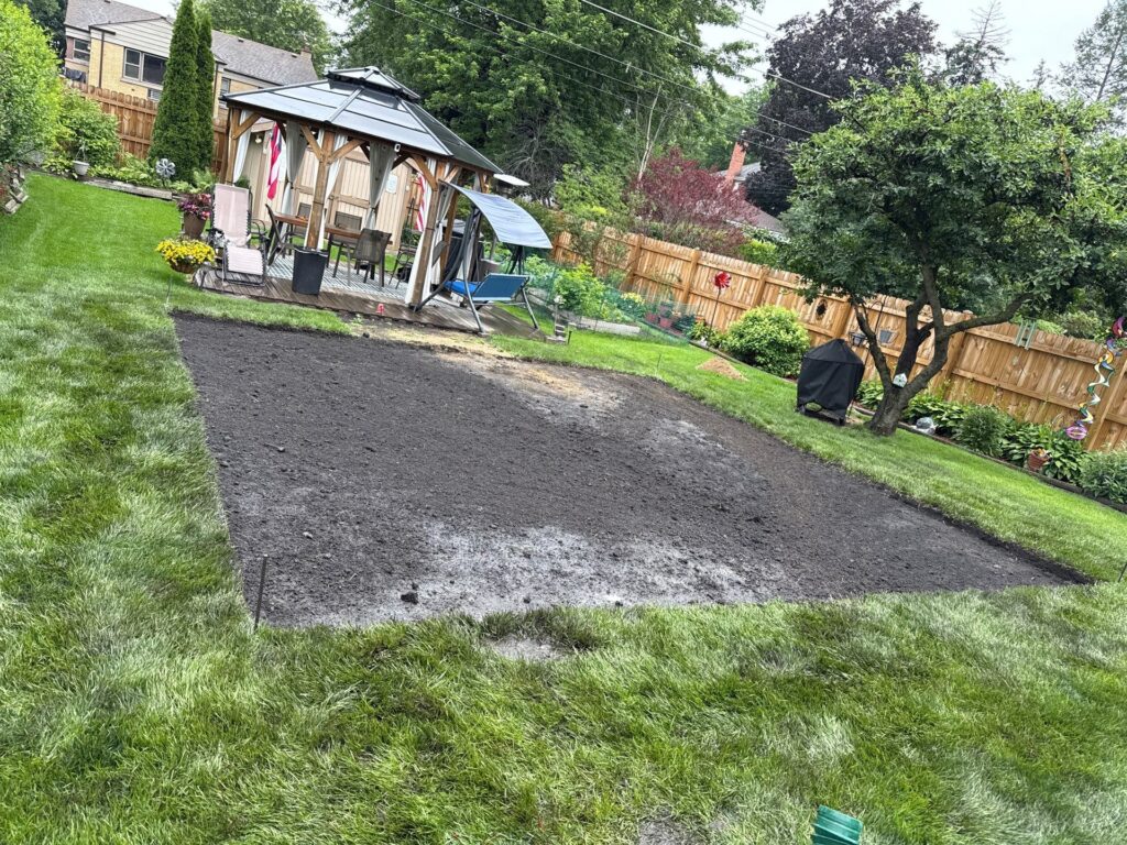 Freshly prepared backyard landscape with new planting area in Mount Prospect