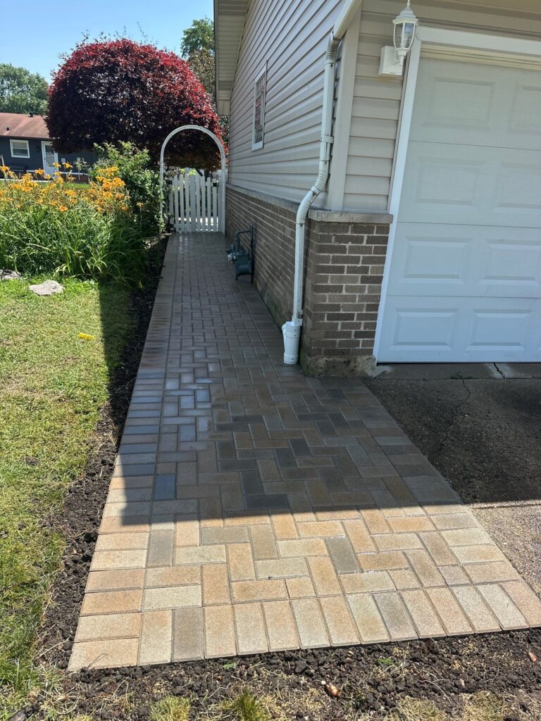 New paver walkway installation beside a Mount Prospect home